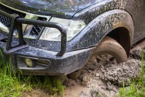 wheels stuck in the mud - NOLA automotive Repairs
